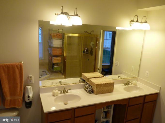 3721 Katie Place Triangle, VA 22172 - Photo 18 of 27 a bathroom with a sink double vanity and a mirror