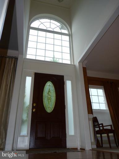 3721 Katie Place Triangle, VA 22172 - Photo 21 of 27 a living room with a window and a wooden floor