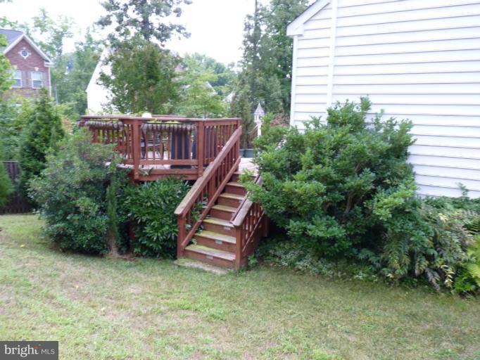 3721 Katie Place Triangle, VA 22172 - Photo 4 of 27 a view of a house with backyard and trees