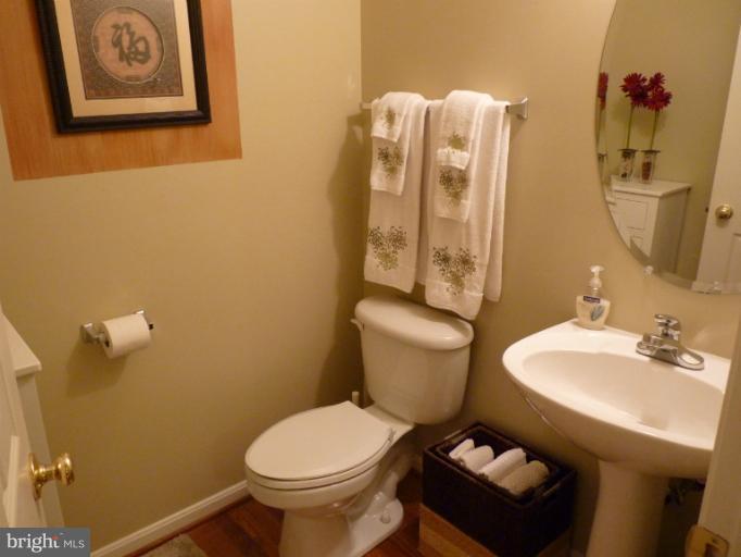 3721 Katie Place Triangle, VA 22172 - Photo 8 of 27 a bathroom with a toilet sink and mirror