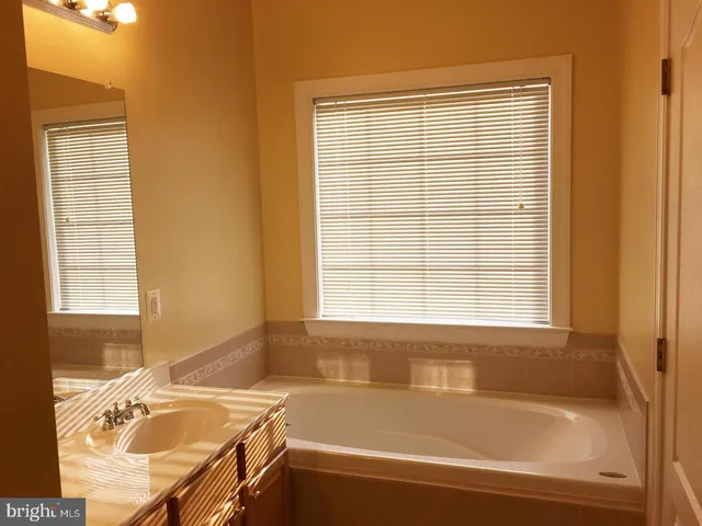 a view of a small space with a large window and a plant