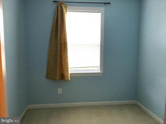 a white toilet sitting next to a sink