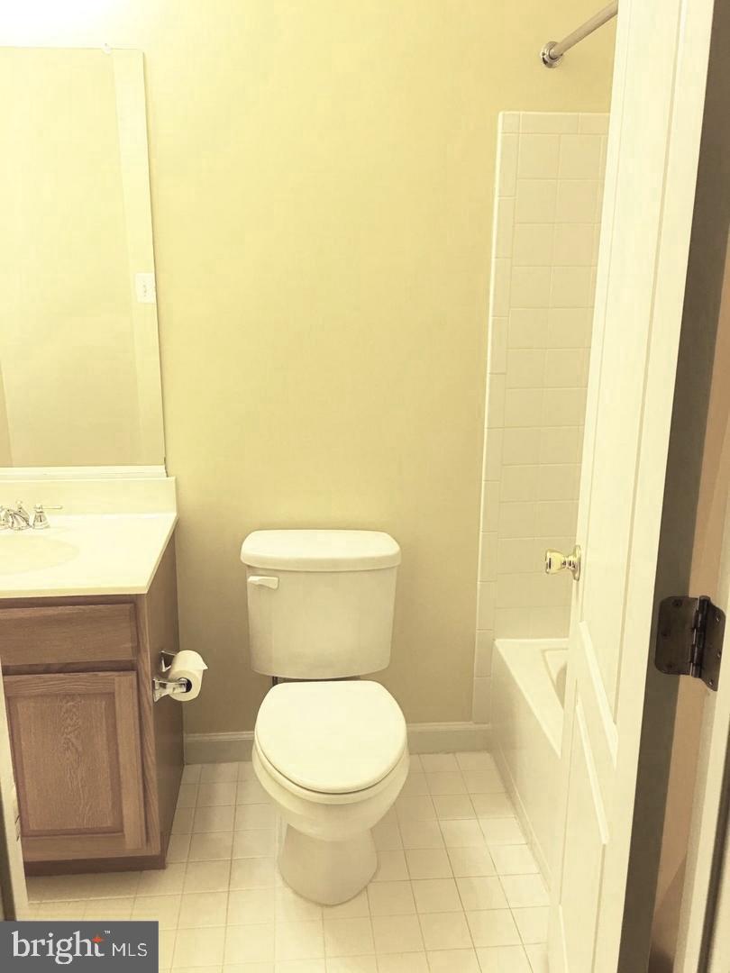 14030 Castle Ridge Way, Unit 27 Silver Spring, MD 20904 - Photo 14 of 19 a white toilet sitting next to a sink