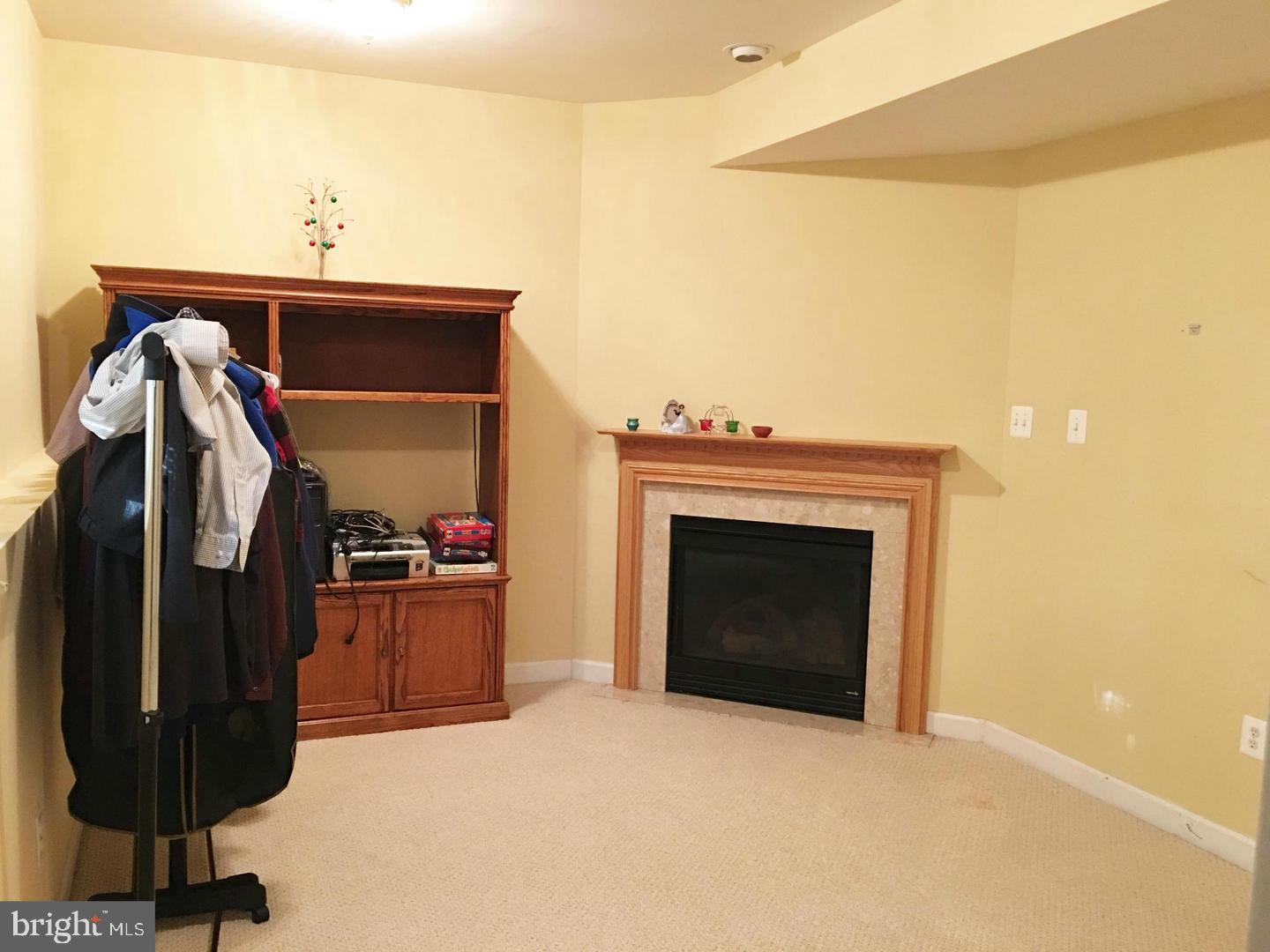 14030 Castle Ridge Way, Unit 27 Silver Spring, MD 20904 - Photo 15 of 19 a view of livingroom with furniture and a fireplace
