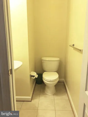 a view of a house with wooden deck