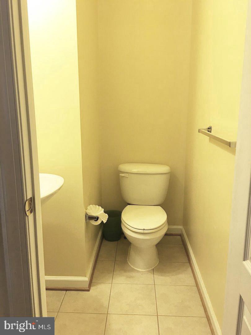 14030 Castle Ridge Way, Unit 27 Silver Spring, MD 20904 - Photo 16 of 19 a bathroom with a toilet and a shower