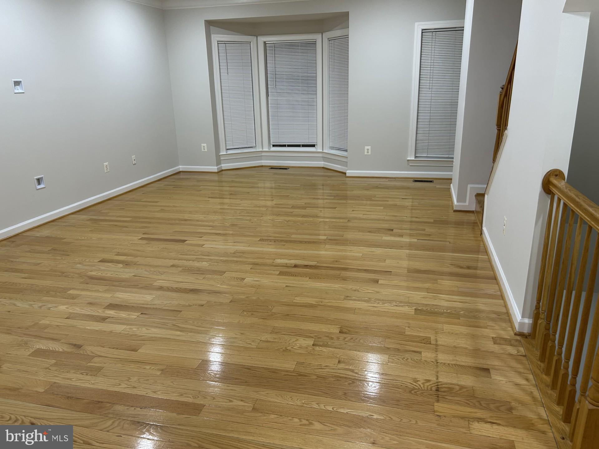 14030 Castle Ridge Way, Unit 27 Silver Spring, MD 20904 - Photo 2 of 19 a view of empty room with wooden floor