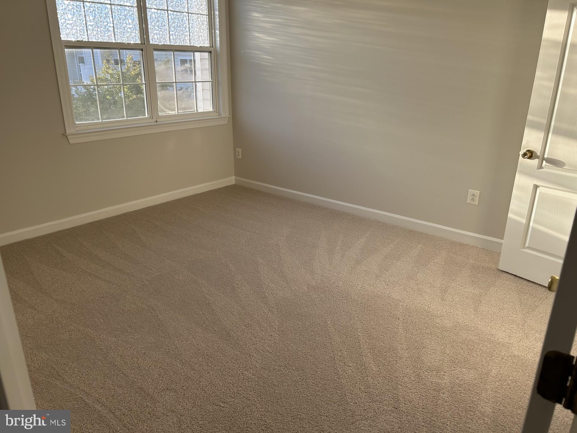 14030 Castle Ridge Way, Unit 27 Silver Spring, MD 20904 - Photo 9 of 19 an empty room with windows