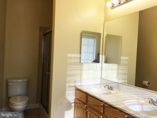 a bathroom with a bathtub and next to a window