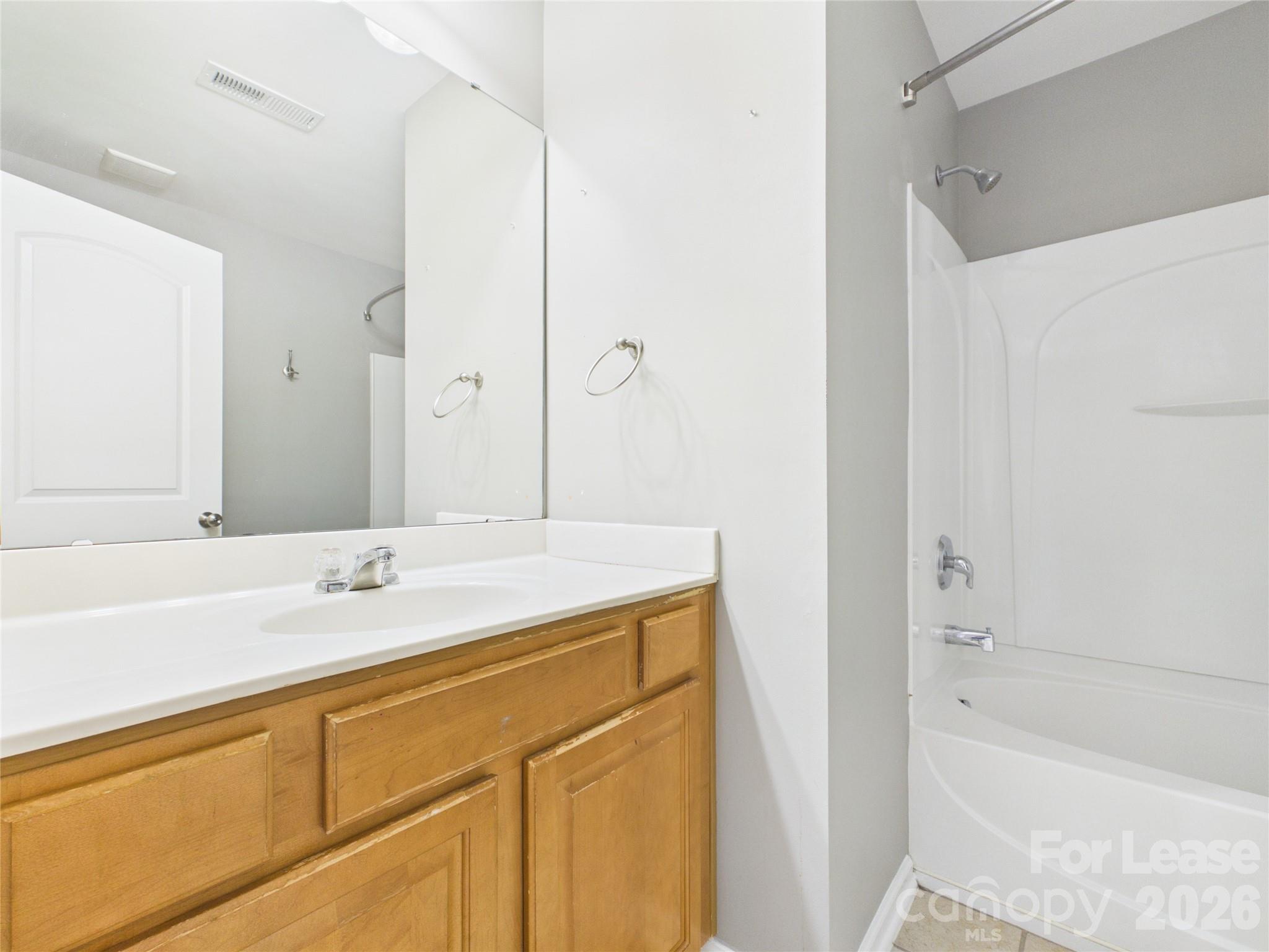 5690 Stafford Road Charlotte, NC 28215 - Photo 20 of 25 a bathroom with a sink and a bathtub
