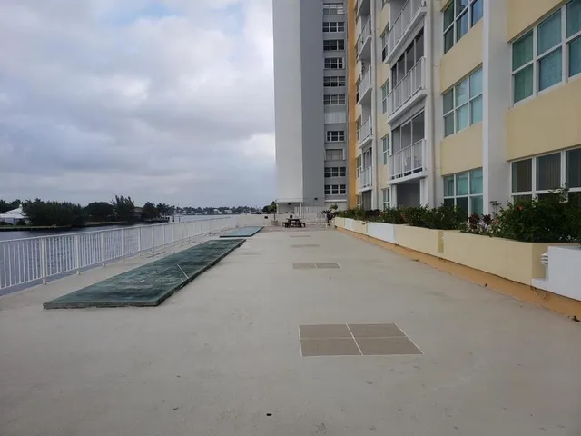 a view of a building with car parked
