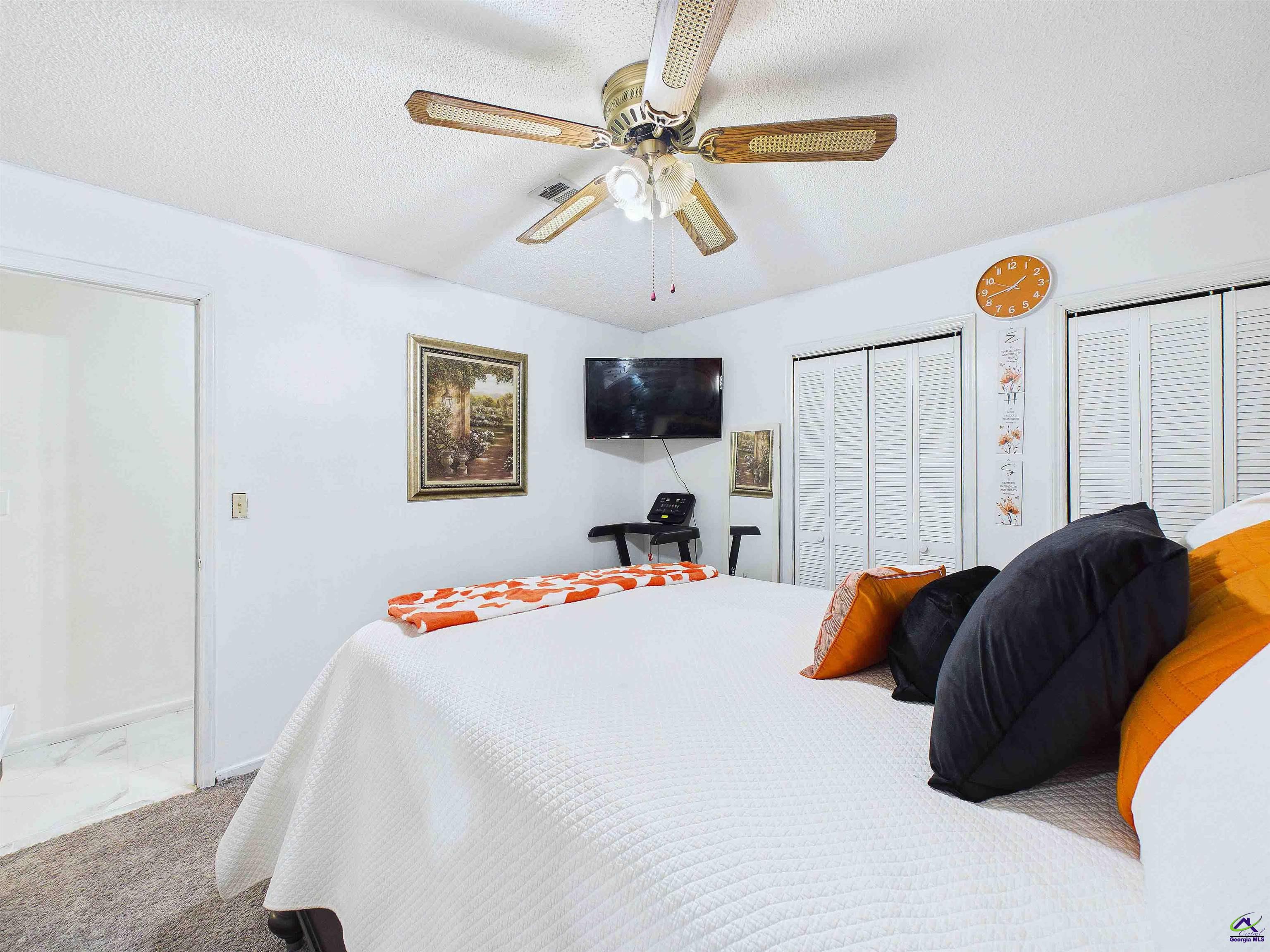 400 Feagin Mill Road Warner Robins, GA 31005 - Photo 45 of 53 a bedroom with a bed and a chandelier
