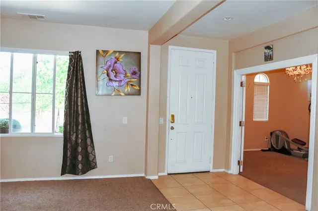 a bathroom with a toilet a sink and a mirror