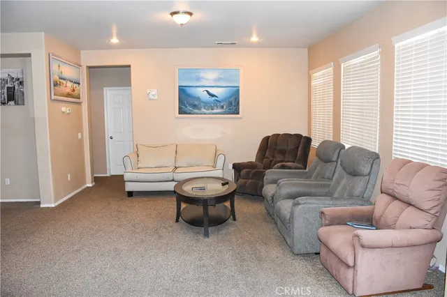 a room with furniture and a flat screen tv