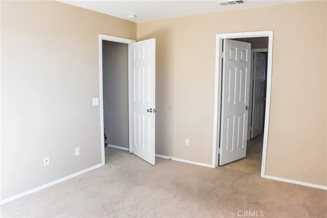 a bathroom with a bathtub a mirror a vanity and a shower
