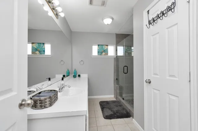 a bathroom with a sink and mirror