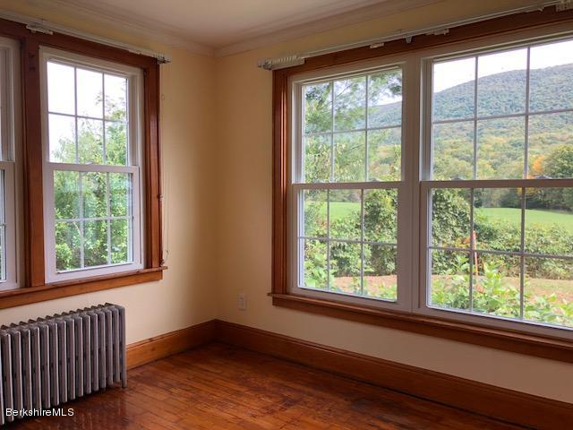 814 River Road Clarksburg, MA 01247 - Photo 14 of 27 a view of an empty room with wooden floor and a window