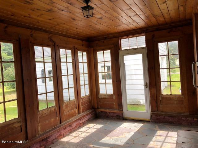 814 River Road Clarksburg, MA 01247 - Photo 4 of 27 a view of an empty room with a window