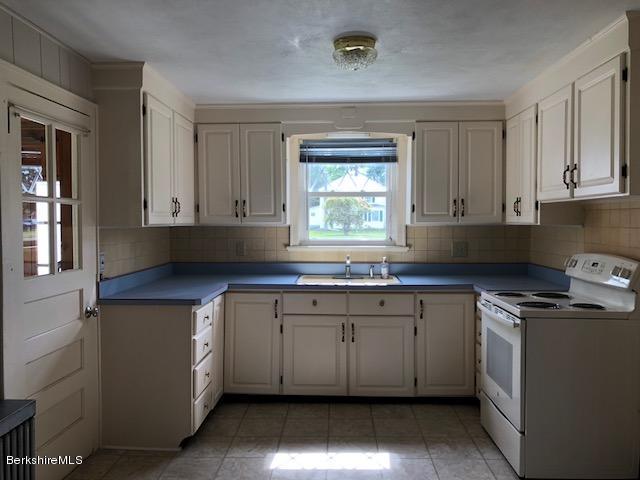 814 River Road Clarksburg, MA 01247 - Photo 5 of 27 a kitchen with stainless steel appliances granite countertop a sink stove and cabinets