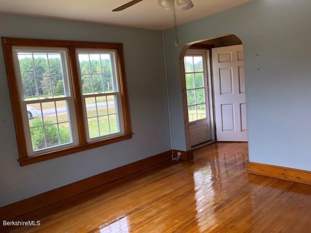 814 River Road Clarksburg, MA 01247 - Photo 8 of 27 a view of an empty room with wooden floor and a window