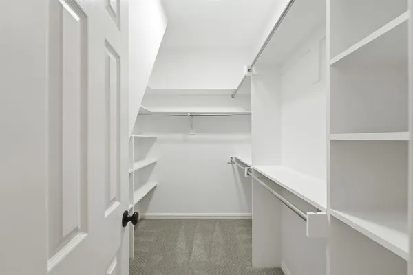 a view of an empty walk in closet