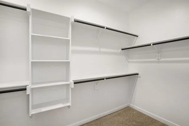 a view of an empty walk in closet