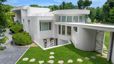 a view of front of house with a yard