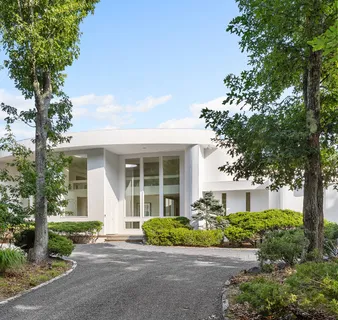 front view of a house with a garden