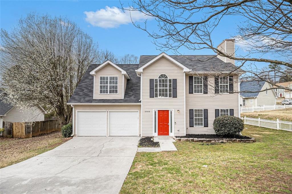 a front view of a house with a yard