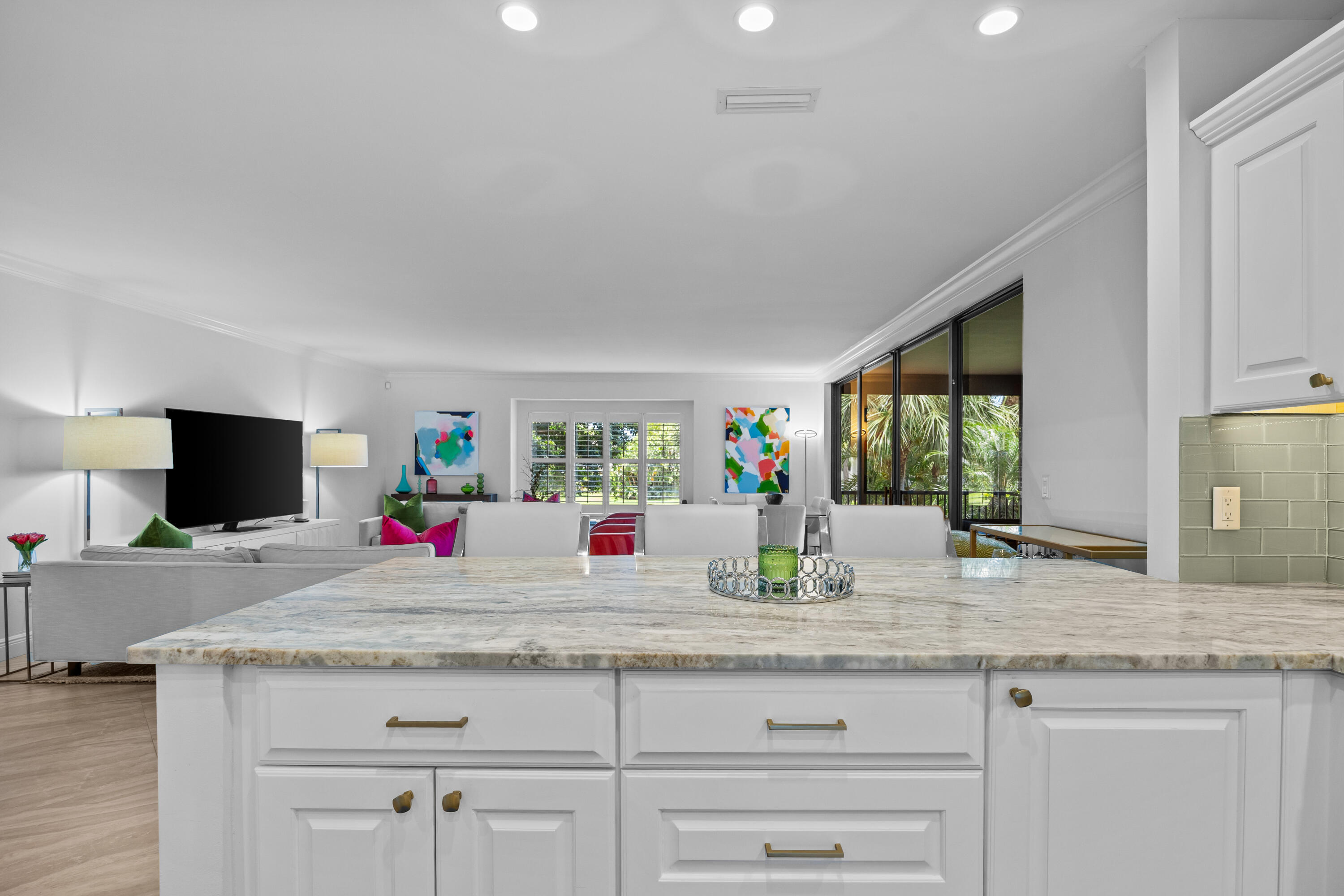 13254 Polo Club Road, Unit C204 Wellington, FL 33414 - Photo 10 of 29 a kitchen with granite countertop a sink and a wooden floor
