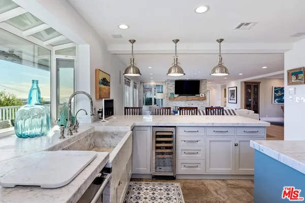 a kitchen with stainless steel appliances granite countertop a stove and a sink