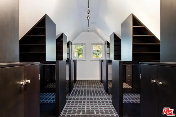a view of a livingroom with furniture and staircase