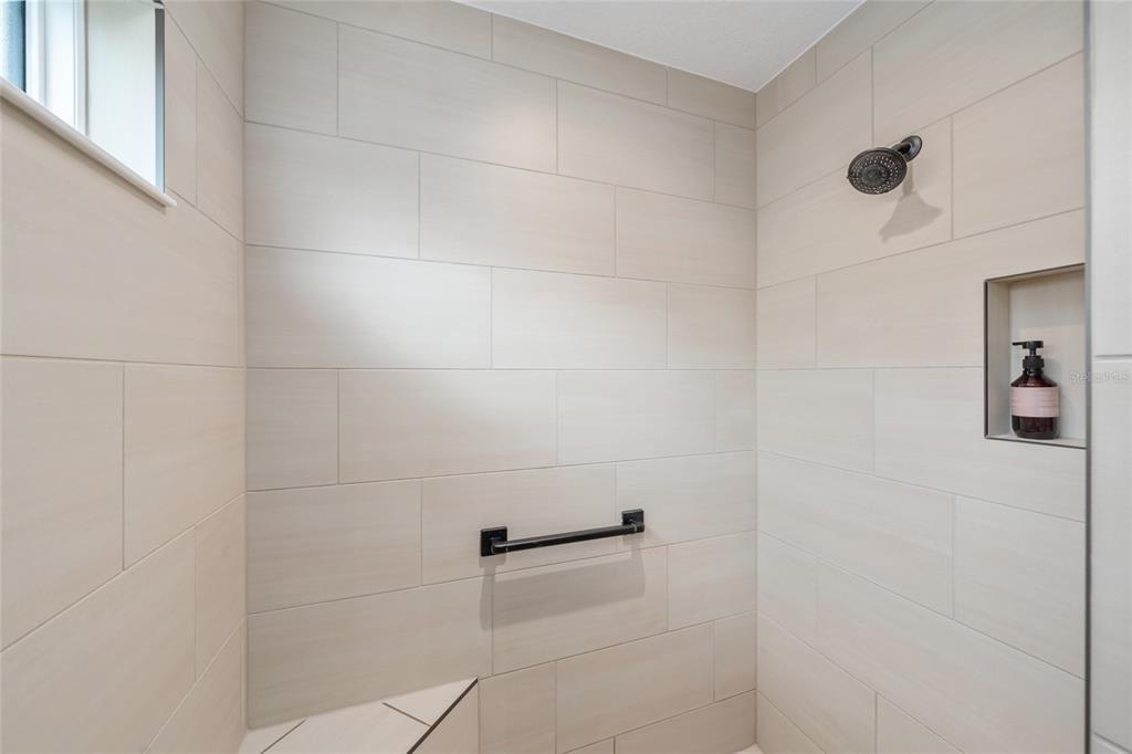 595 Randall Road The Villages, FL 32163 - Photo 23 of 42 a bathroom with a shower