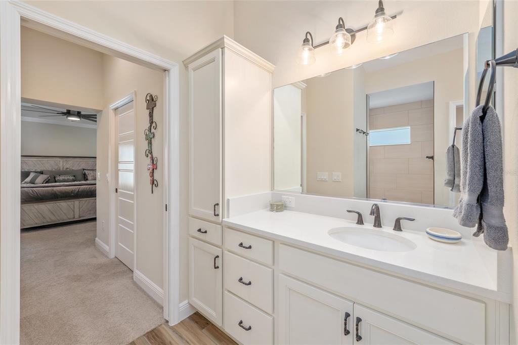 595 Randall Road The Villages, FL 32163 - Photo 25 of 42 a bathroom with a sink double vanity and a mirror