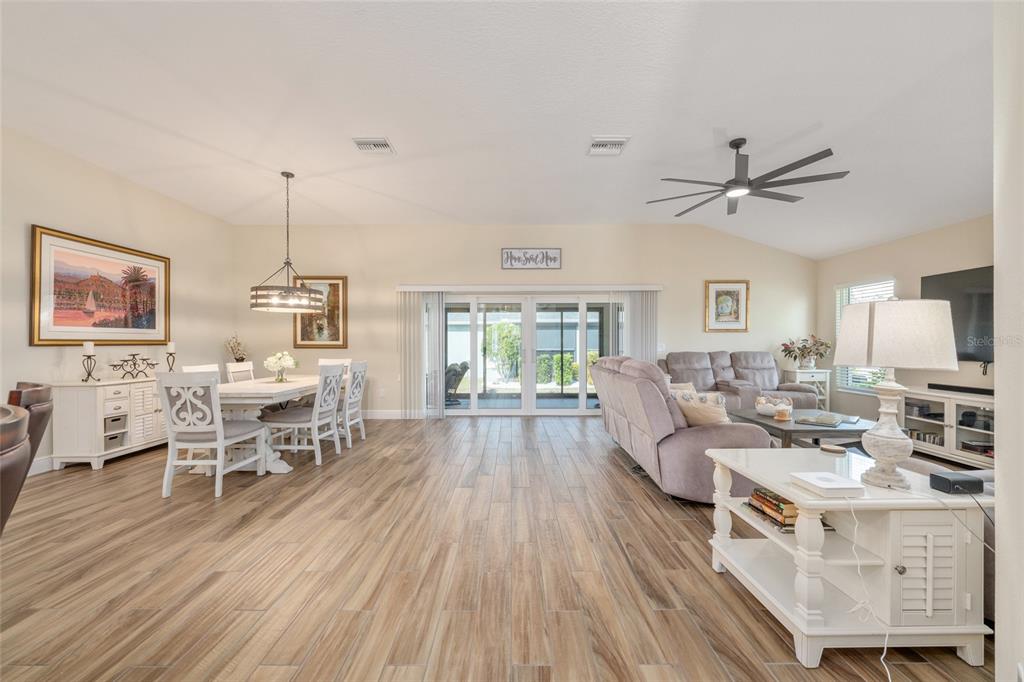 595 Randall Road The Villages, FL 32163 - Photo 26 of 42 a living room with furniture wooden floor and a window