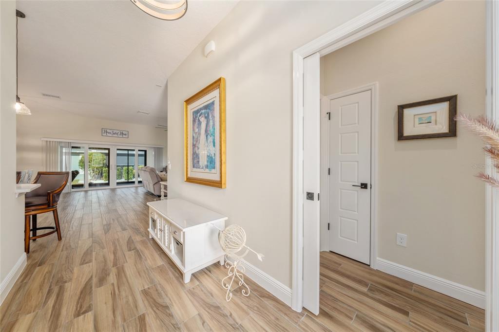 595 Randall Road The Villages, FL 32163 - Photo 27 of 42 a living room with furniture and a wooden floor