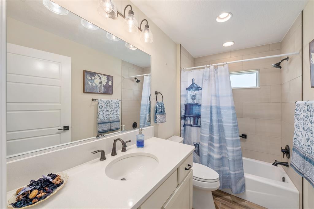 595 Randall Road The Villages, FL 32163 - Photo 30 of 42 a bathroom with a sink toilet and shower