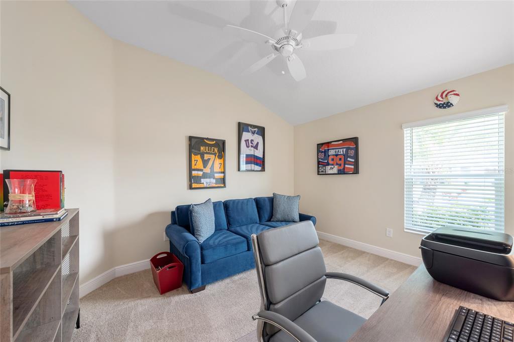 595 Randall Road The Villages, FL 32163 - Photo 32 of 42 a living room with furniture and a window
