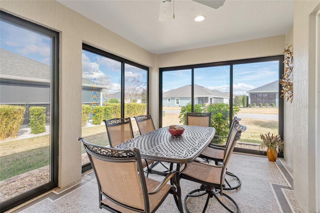 595 Randall Road The Villages, FL 32163 - Photo 35 of 42 a dining room with furniture window and outside view