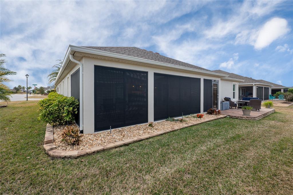 595 Randall Road The Villages, FL 32163 - Photo 38 of 42 a front view of a house with a yard