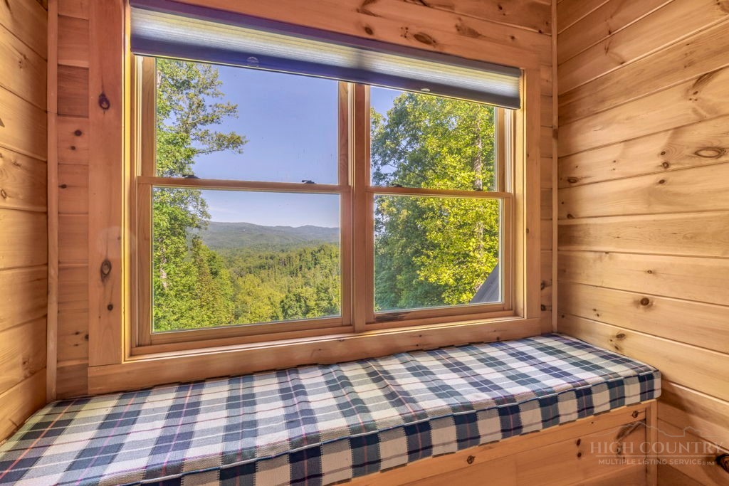 2229 Elk Ridge Road Ferguson, NC 28624 - Photo 28 of 42 a bedroom with a bed and a window