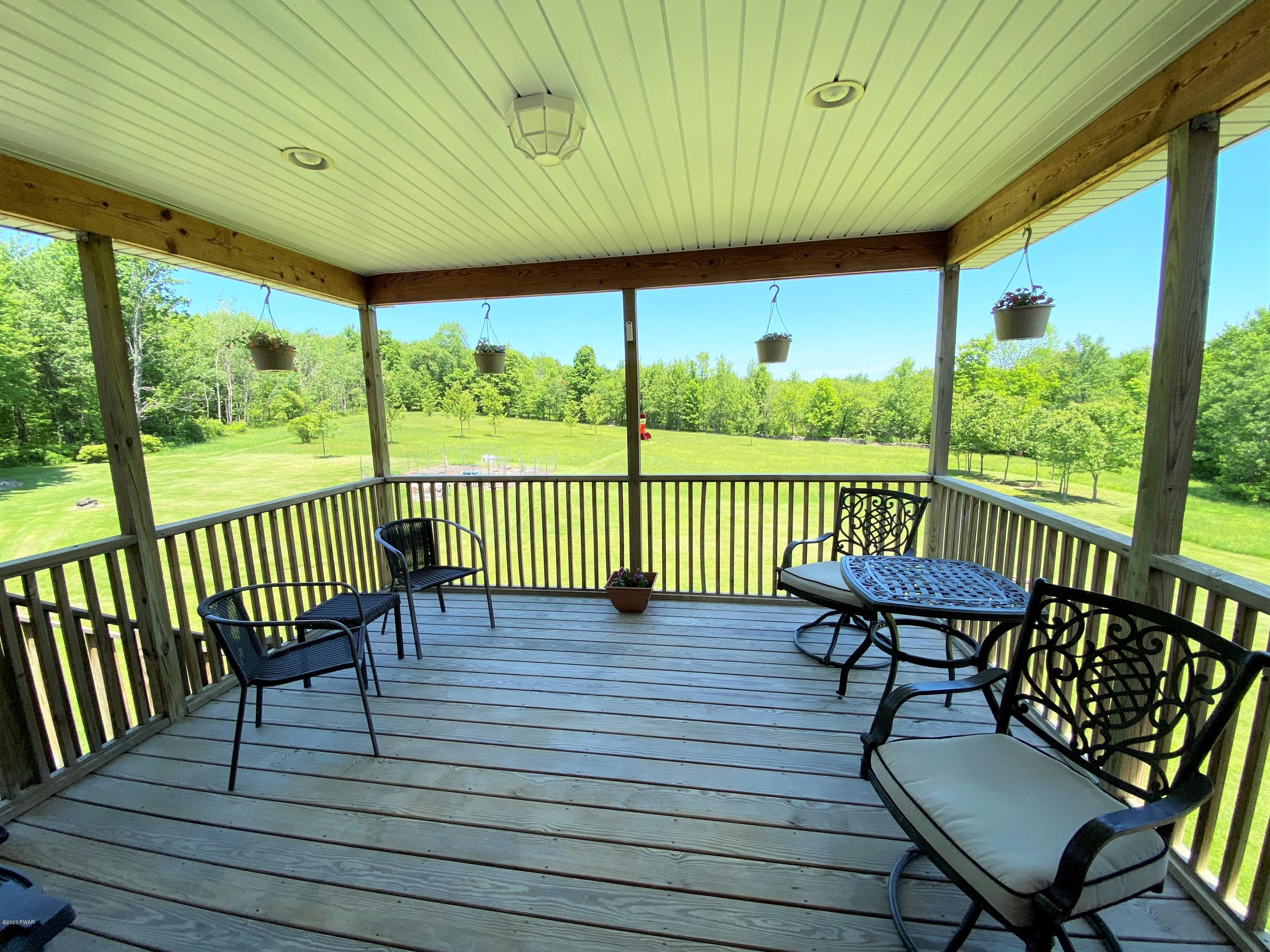 134 Romobe Lake Road Thompson, PA 18465 - Photo 12 of 93 covered deck