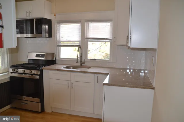 a close view of wooden cabinets and fireplace