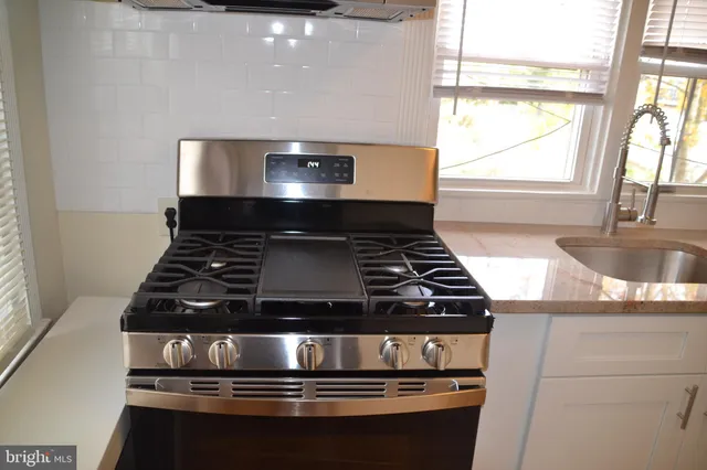 a view of storage and utility room with empty racks