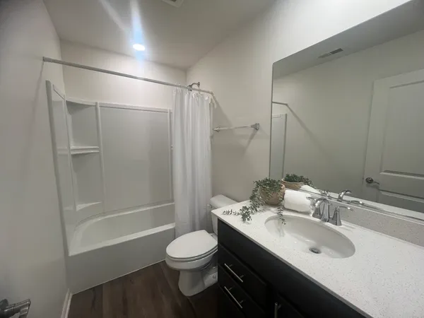 a view of entryway with wooden floor and stairs