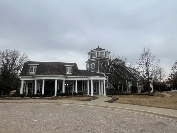 a view of roof deck with a barbeque and wooden stairs