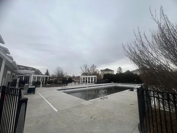 a view of swimming pool from a balcony