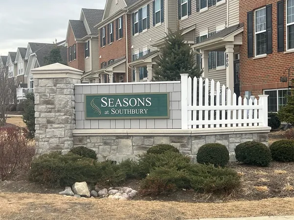 a street sign on a pole next to a building