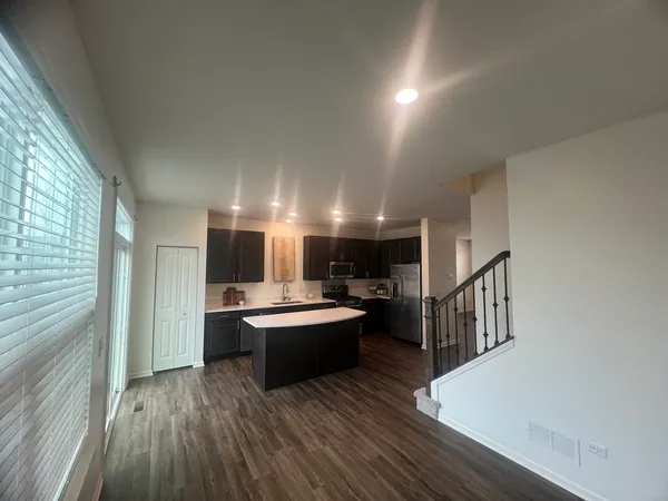 a living room with fireplace furniture and a wooden floor