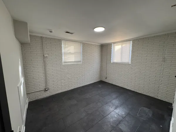 an empty room with a empty space and window